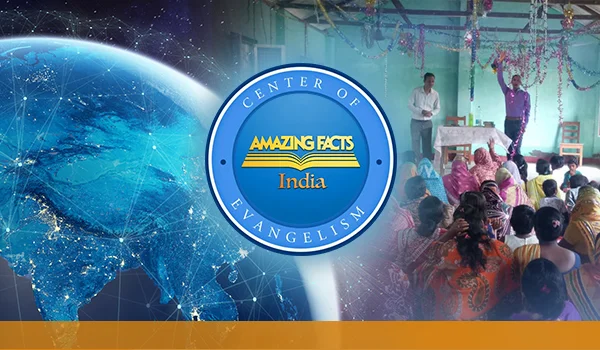 A group of people, mostly women, sit inside a decorated room listening to two men speaking from a podium. Beside this scene is a circular logo with the text "Center of Evangelism – Amazing Facts India." The background features a digital view of Earth from space with glowing network lines, symbolizing global connectivity and outreach.